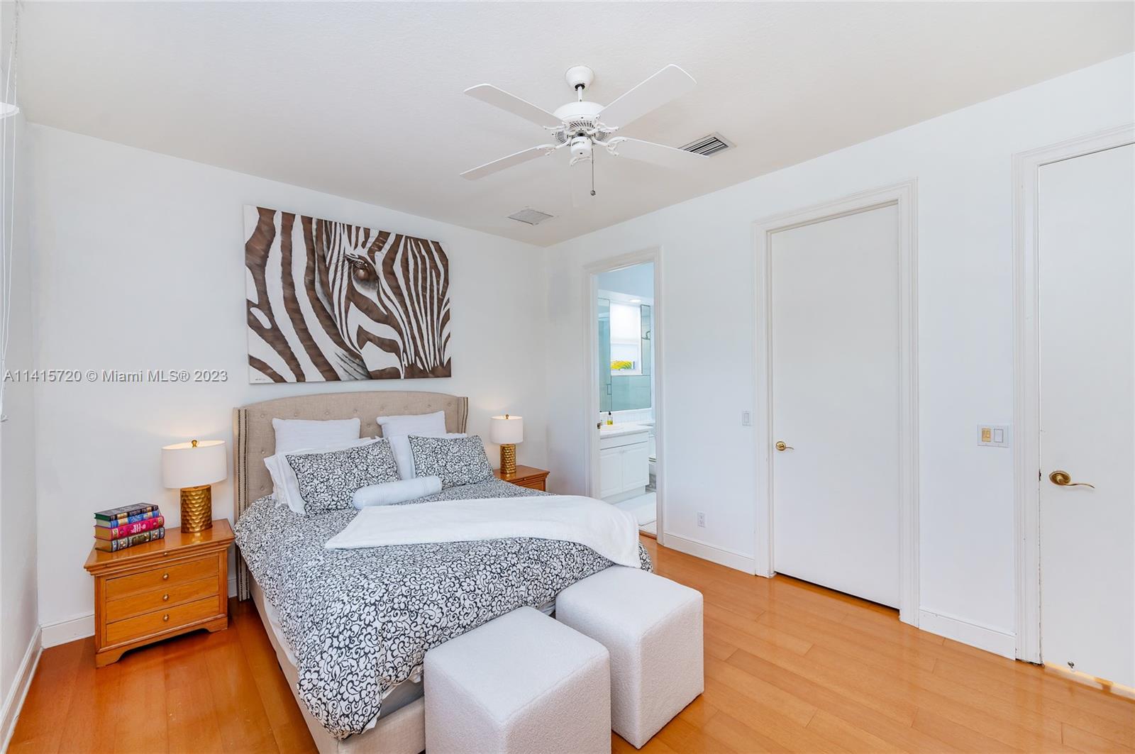 4167 Briarcliff Circle Boca Raton, FL 33496 - Photo 31 of 56 a living room with furniture and a chandelier