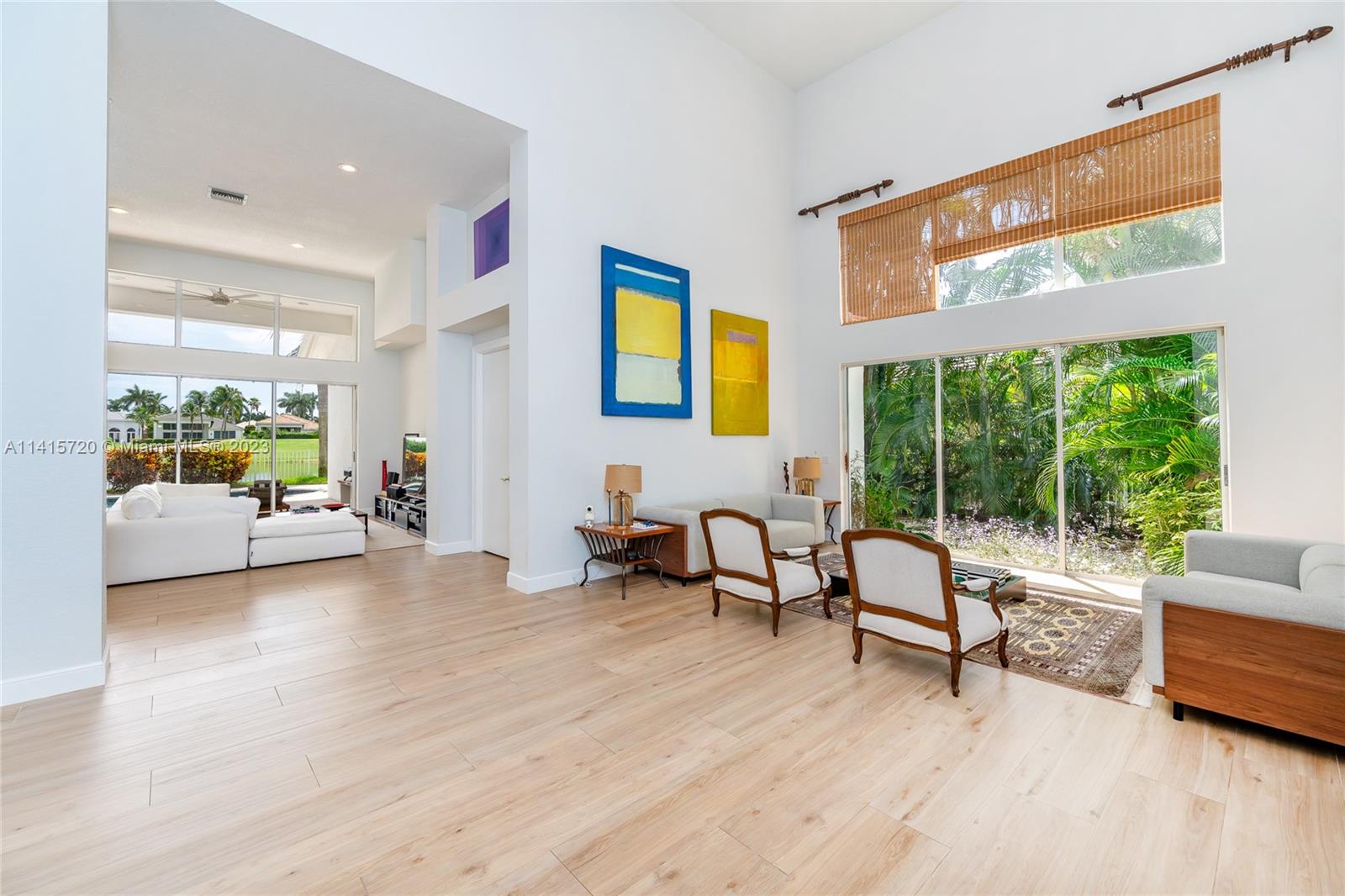 4167 Briarcliff Circle Boca Raton, FL 33496 - Photo 5 of 56 a living room with furniture and a large window