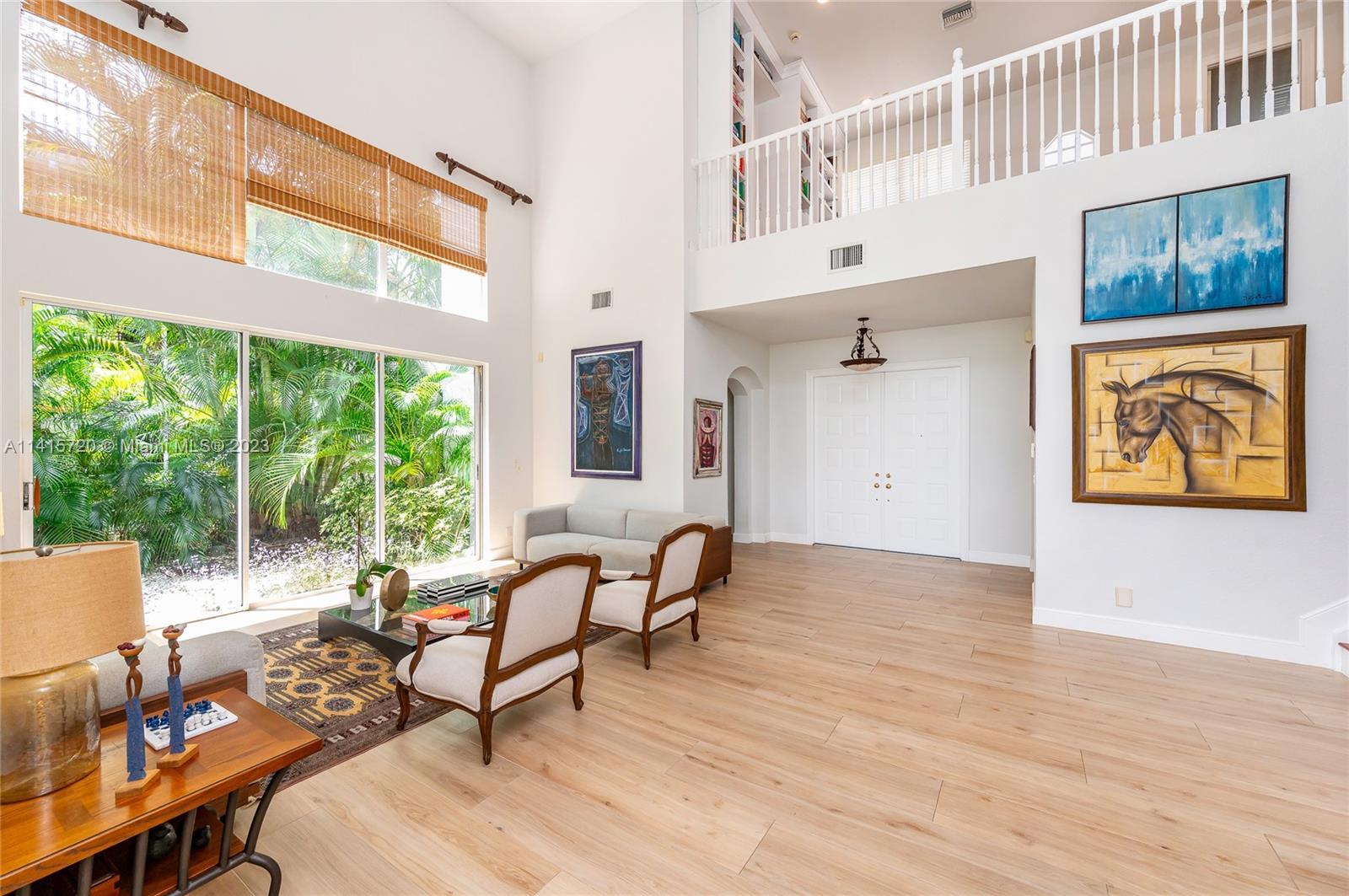 4167 Briarcliff Circle Boca Raton, FL 33496 - Photo 6 of 56 a living room with furniture and floor to ceiling windows