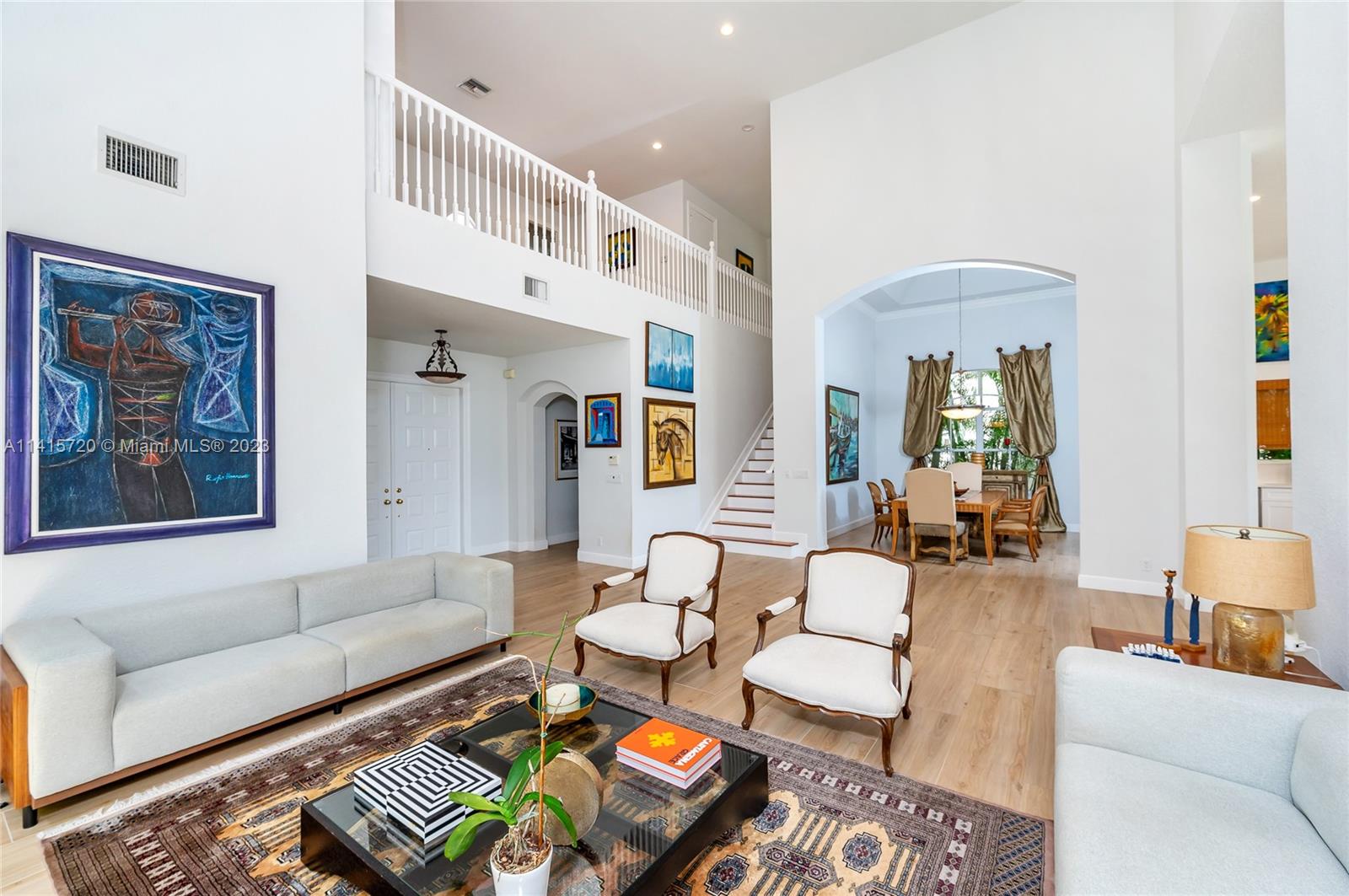 4167 Briarcliff Circle Boca Raton, FL 33496 - Photo 9 of 56 a living room with furniture and a rug