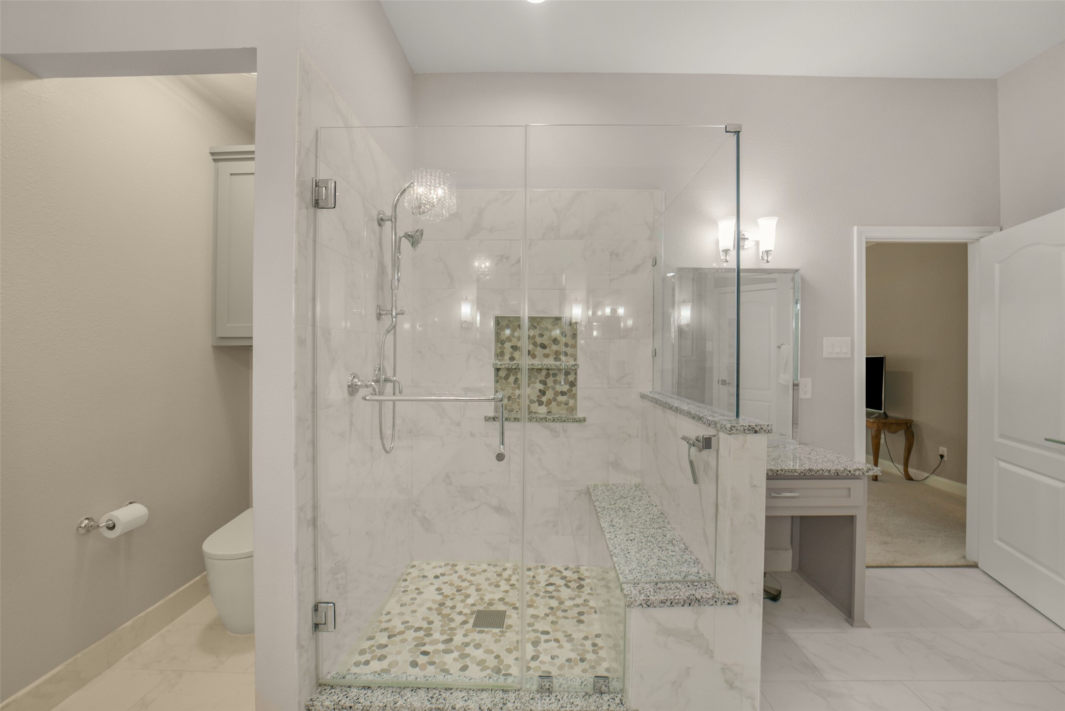 1310 Lambourne Circle Spring, TX 77379 - Photo 32 of 50 Custom shower with specialized cleanout drain and Grohe toilet and additional shelves in the spacious closet