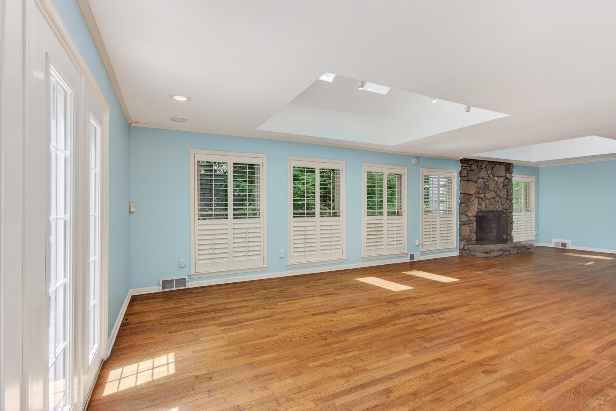 3121 Beechrun Drive Memphis, TN 38128 - Photo 10 of 40 There are two new Velux skylights in this room that add even more natural light, with the surrounding windows filled with hues of green from the mature landscaping that awaits just outside. *The skylights do have blinds as well.