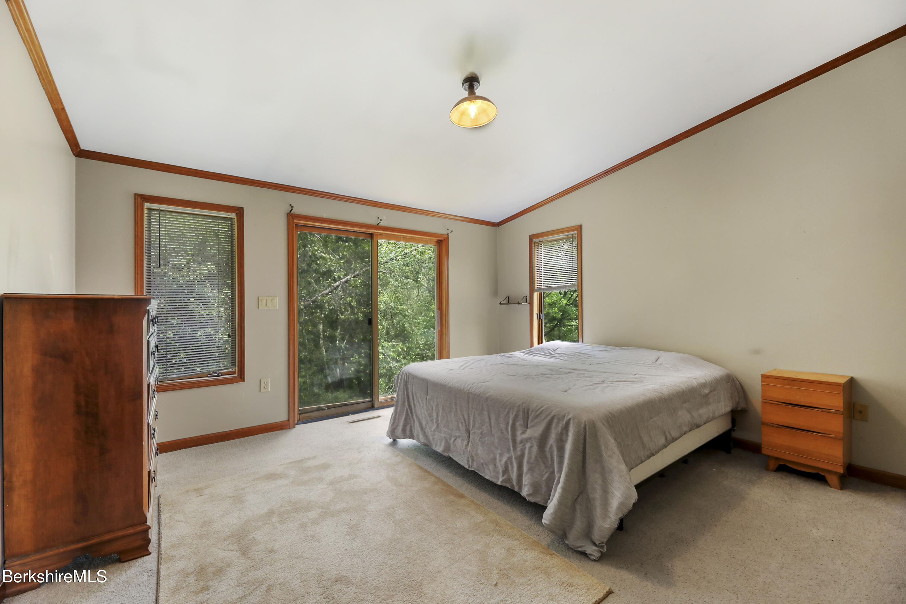 77 Shawnee Shore Road Becket, MA 01223 - Photo 11 of 28 a bedroom with a bed and window