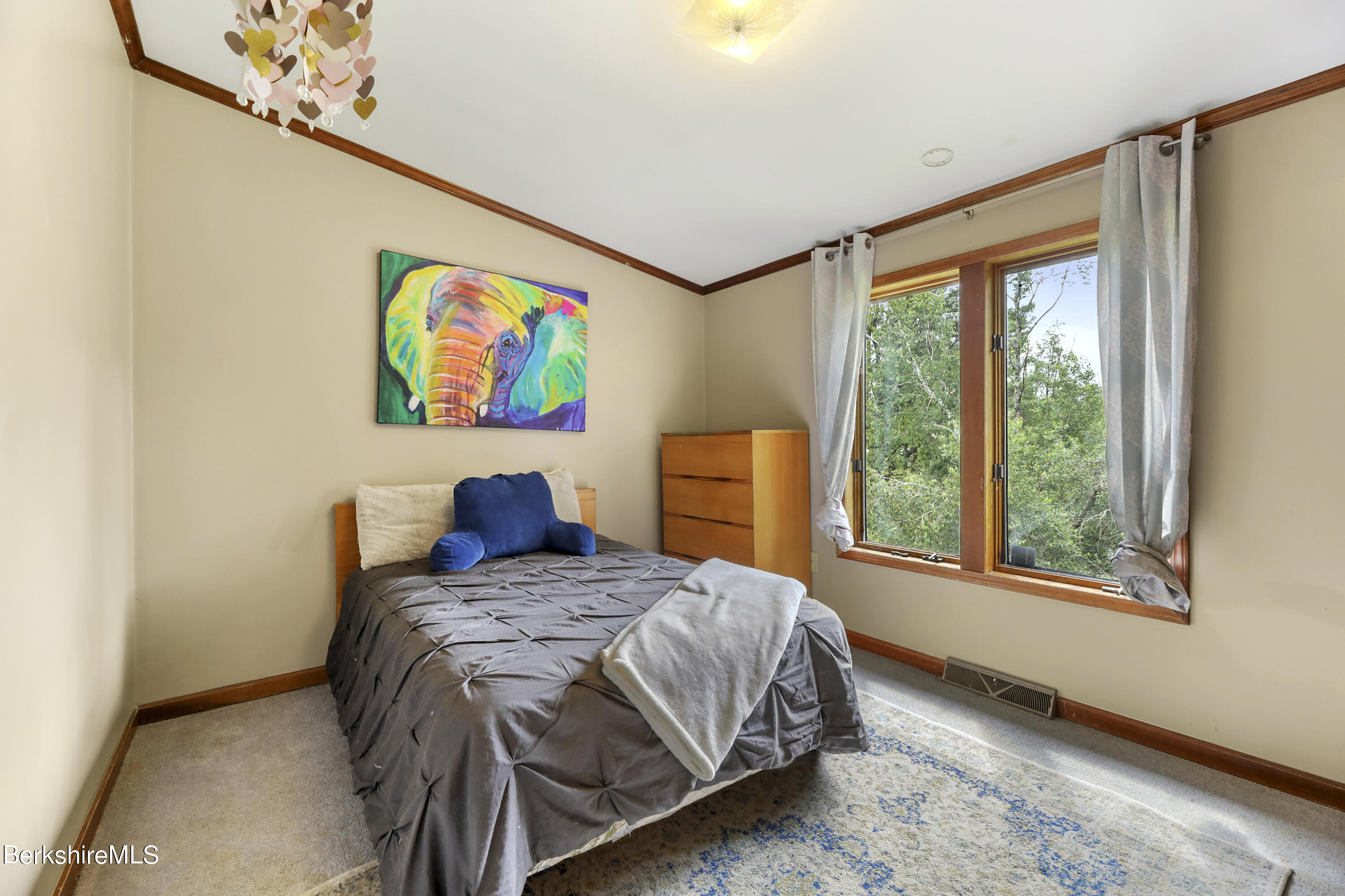 77 Shawnee Shore Road Becket, MA 01223 - Photo 12 of 28 a bedroom with a bed and a painting on the wall