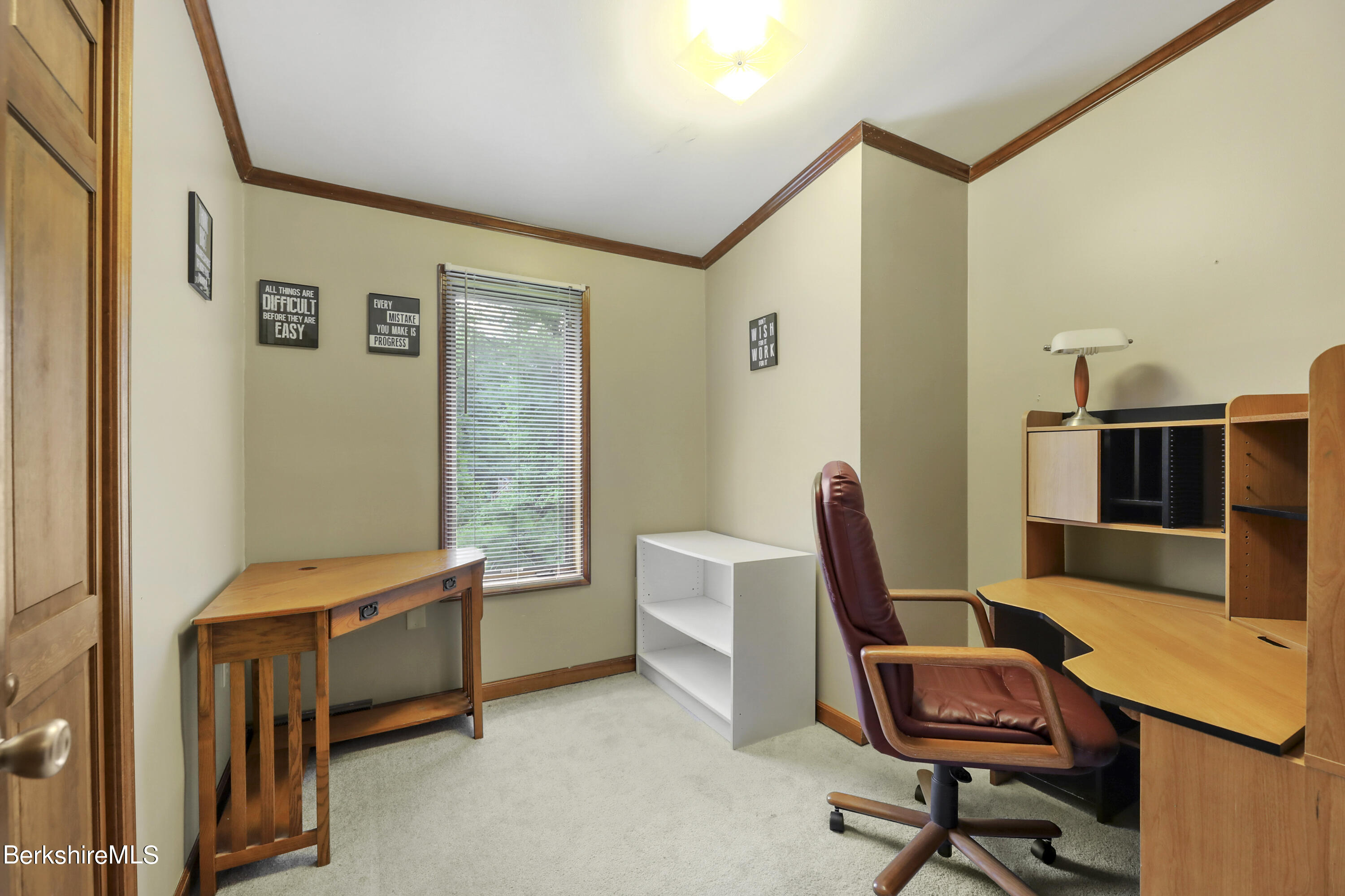 77 Shawnee Shore Road Becket, MA 01223 - Photo 14 of 28 a view of a workspace with furniture and a window