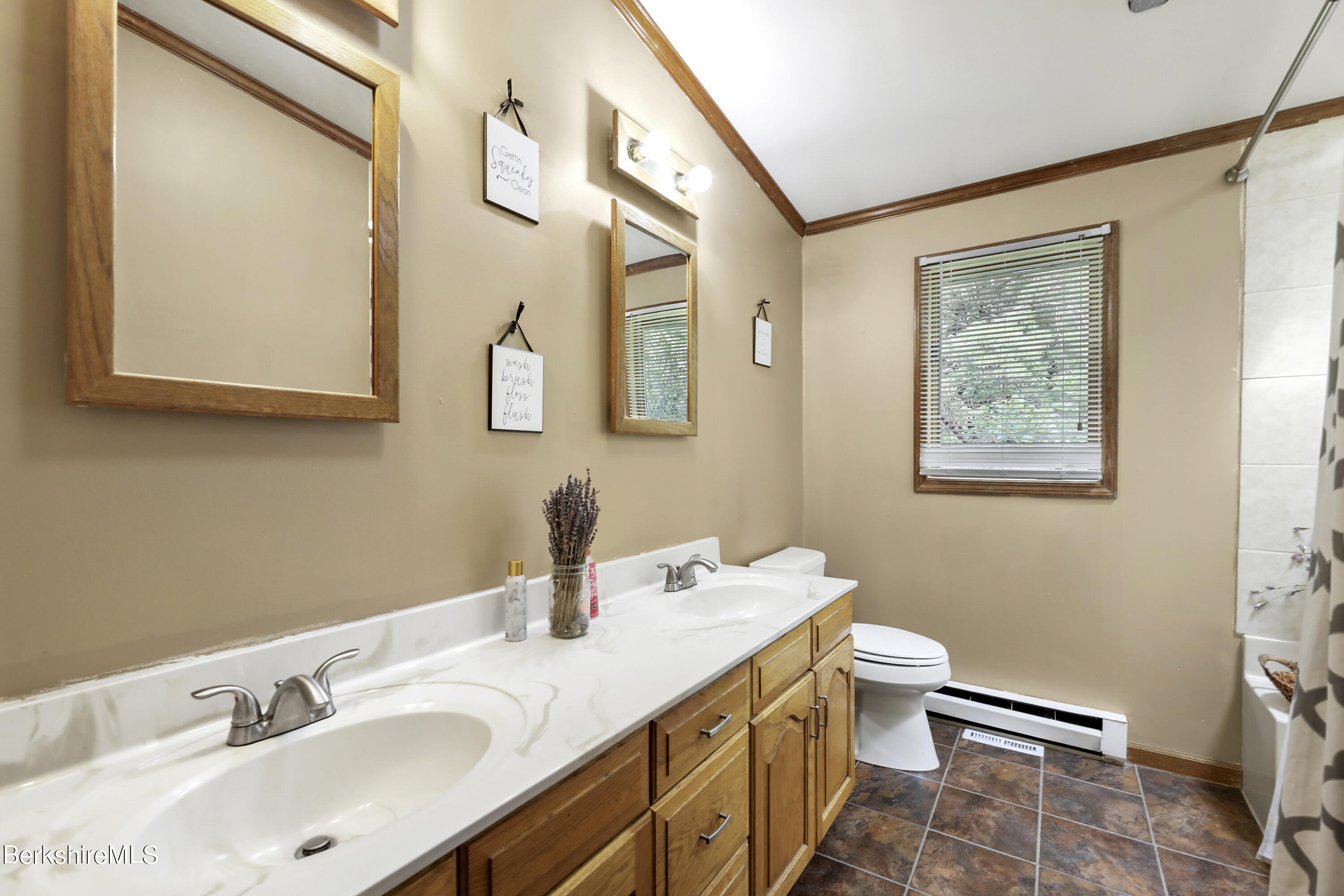 77 Shawnee Shore Road Becket, MA 01223 - Photo 15 of 28 a bathroom with 2 sink and a mirror