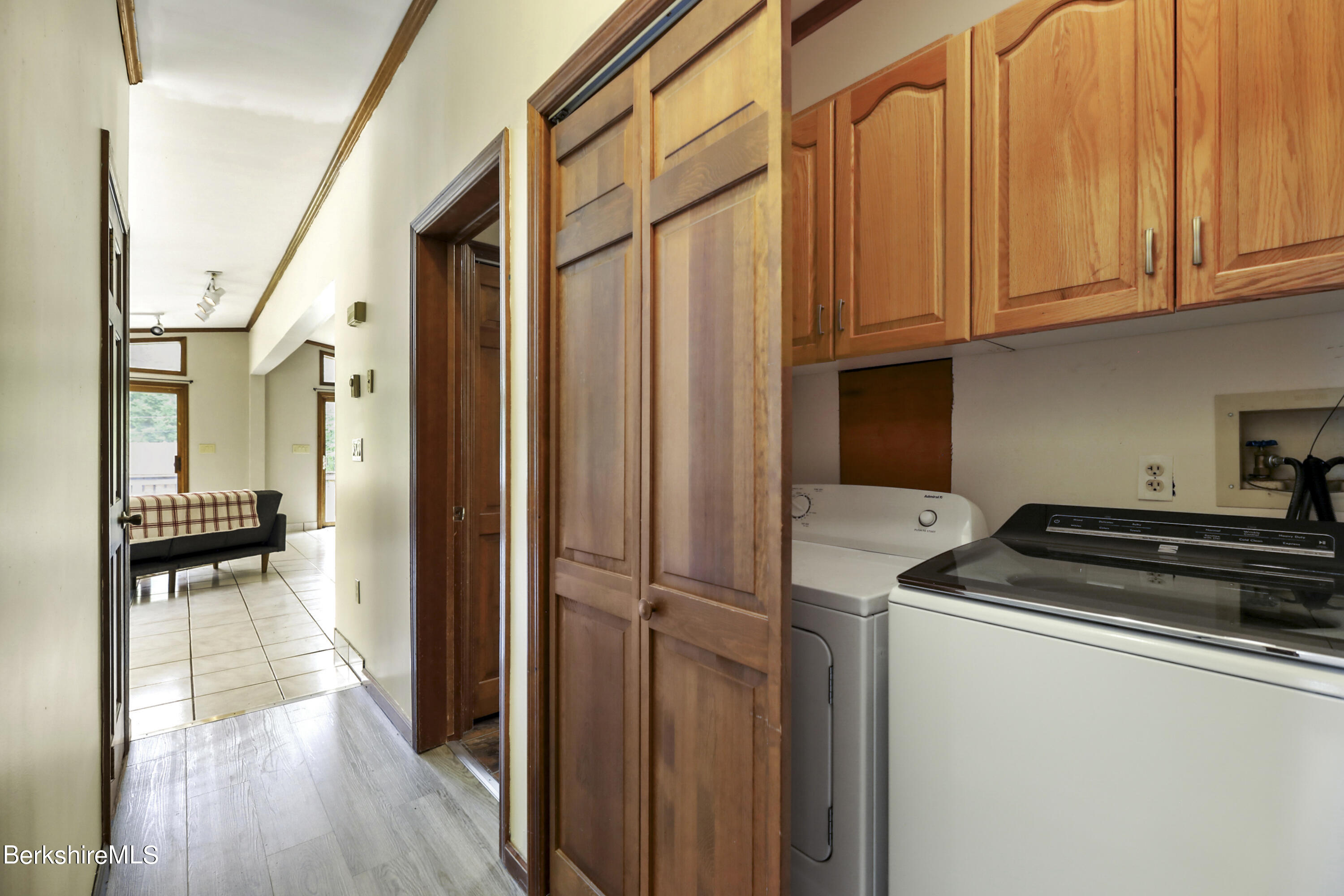 77 Shawnee Shore Road Becket, MA 01223 - Photo 17 of 28 a kitchen with a refrigerator a stove and cabinets