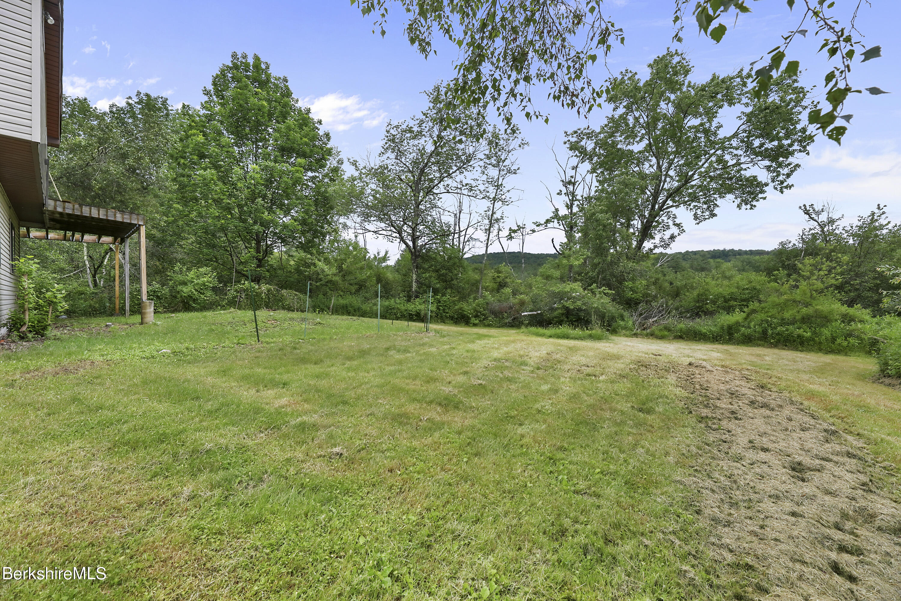 77 Shawnee Shore Road Becket, MA 01223 - Photo 24 of 28 a view of a backyard