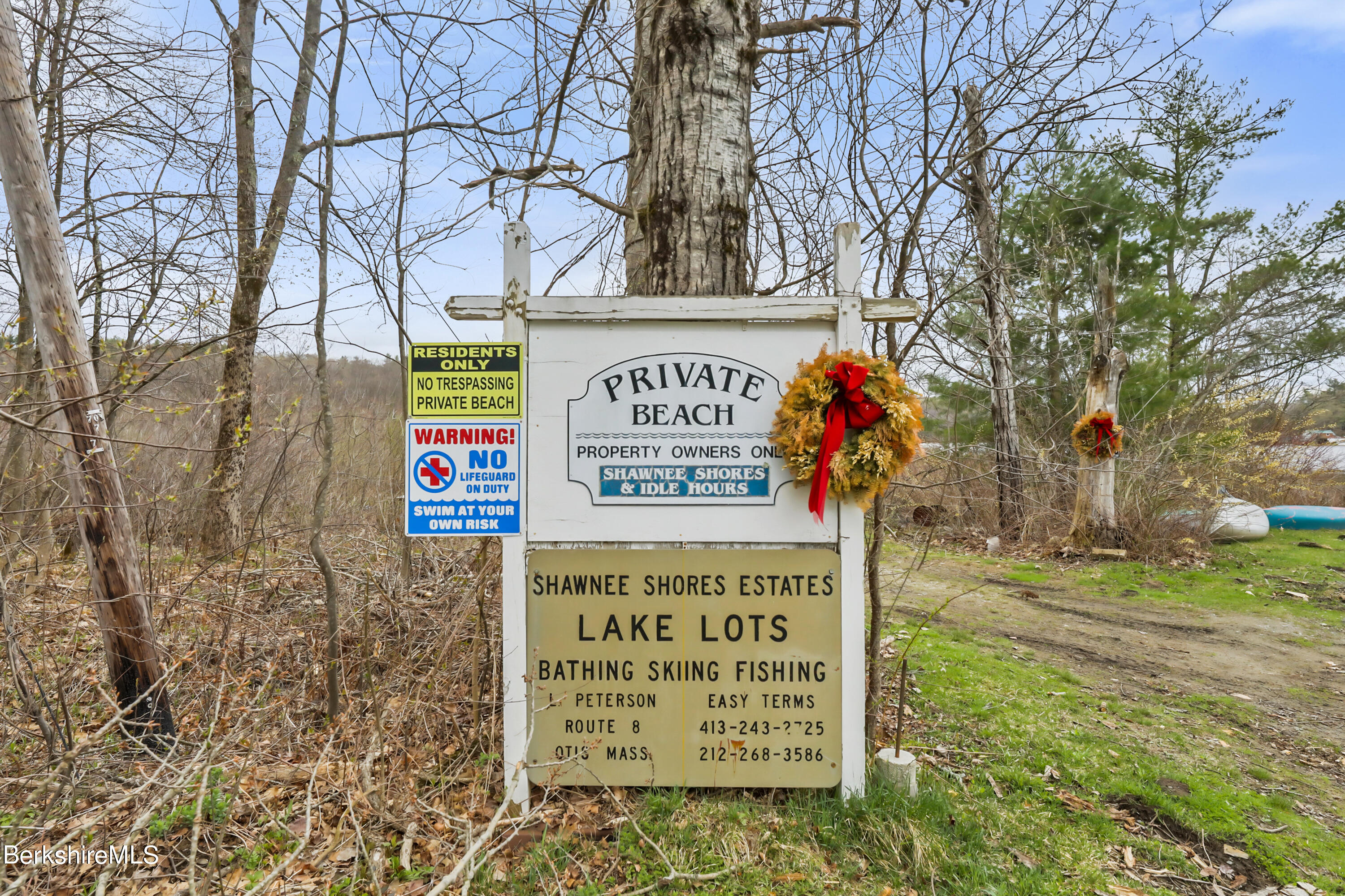 77 Shawnee Shore Road Becket, MA 01223 - Photo 27 of 28 a sign on the side of the road