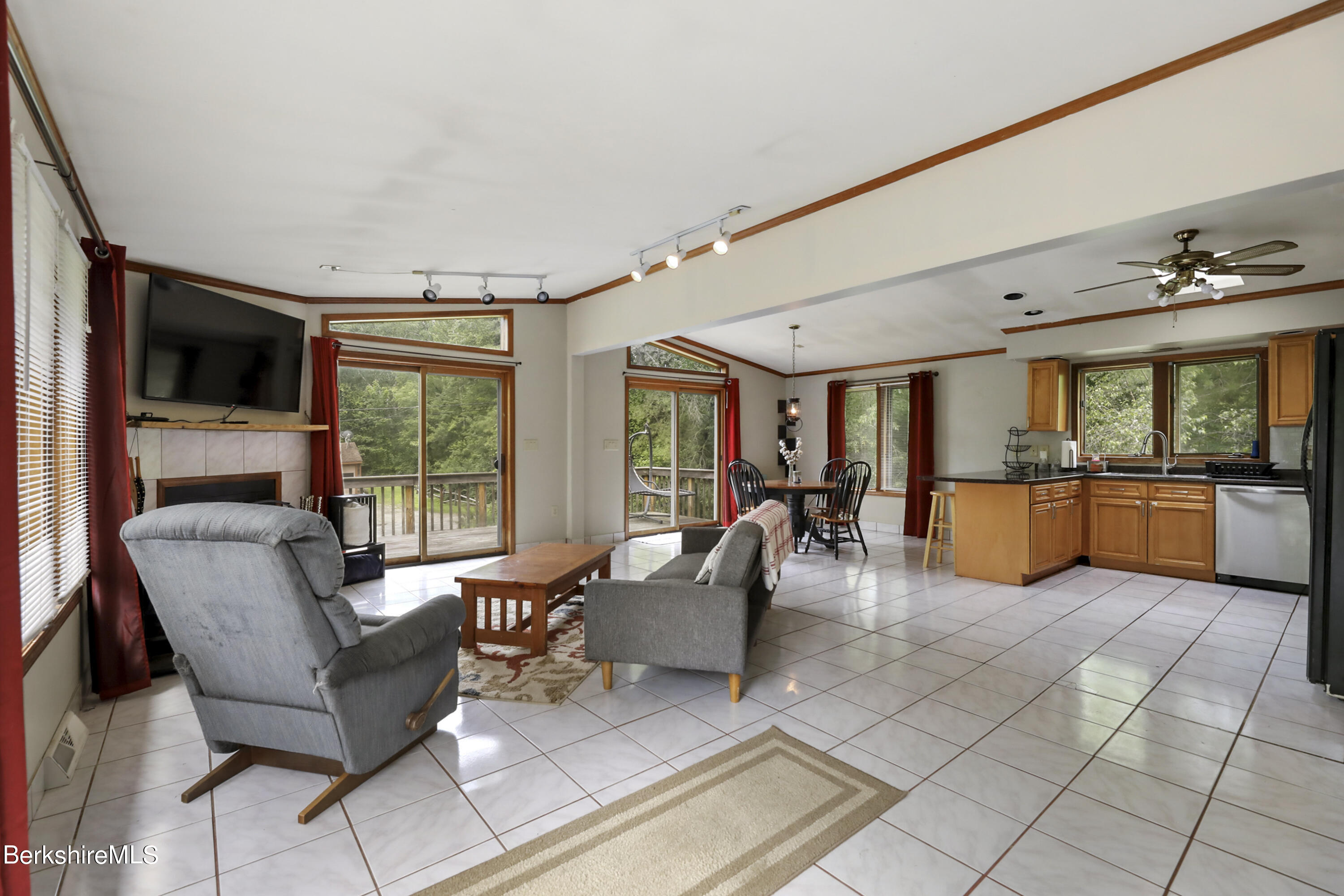 77 Shawnee Shore Road Becket, MA 01223 - Photo 3 of 28 a living room with furniture and a flat screen tv