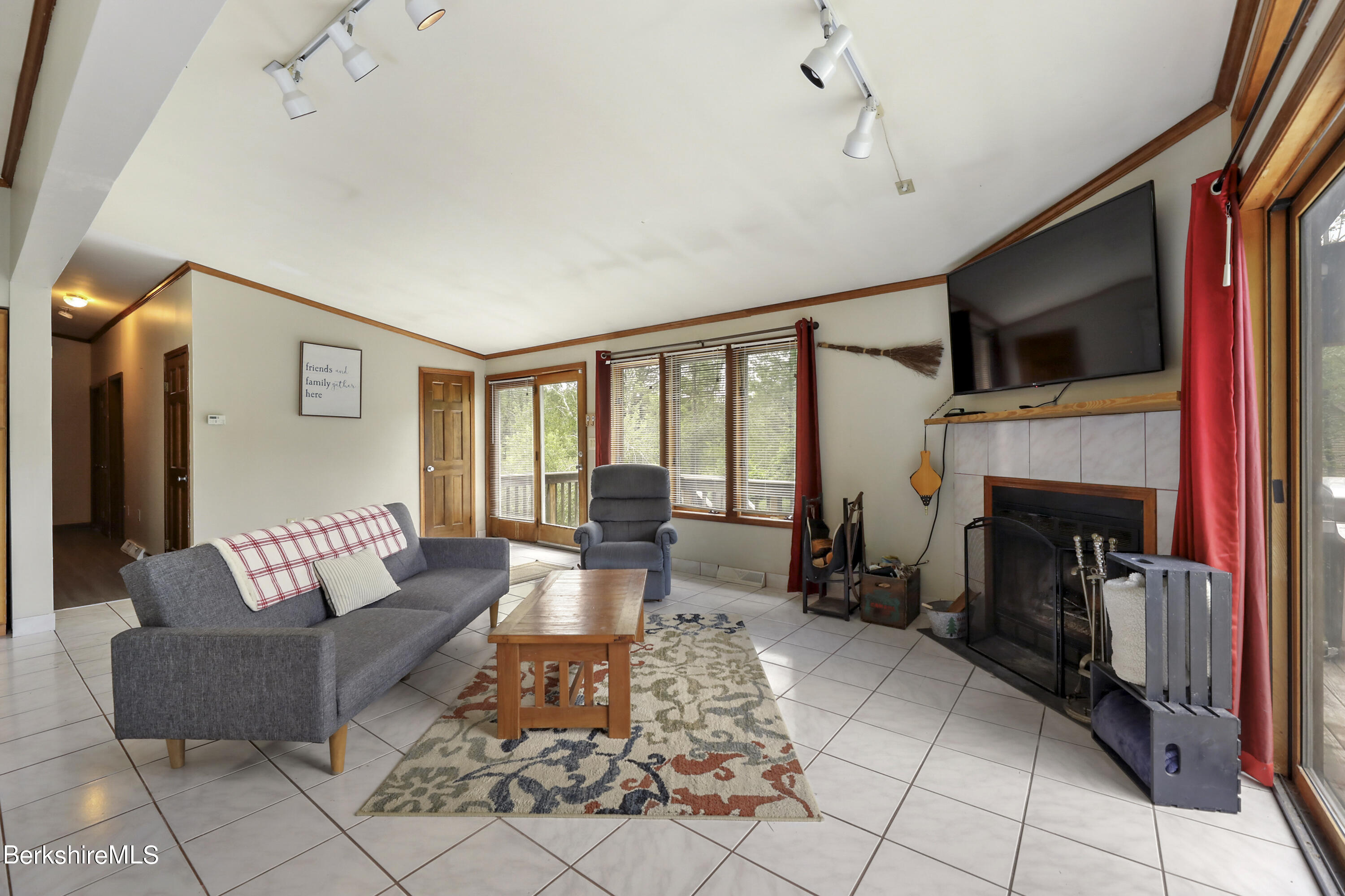 77 Shawnee Shore Road Becket, MA 01223 - Photo 4 of 28 a living room with furniture and a fireplace