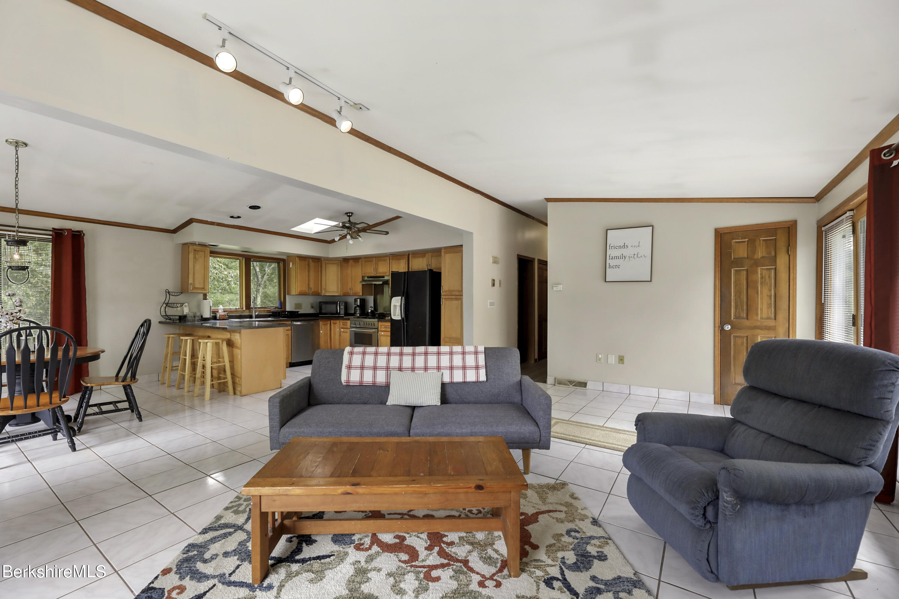 77 Shawnee Shore Road Becket, MA 01223 - Photo 5 of 28 a living room filled with furniture