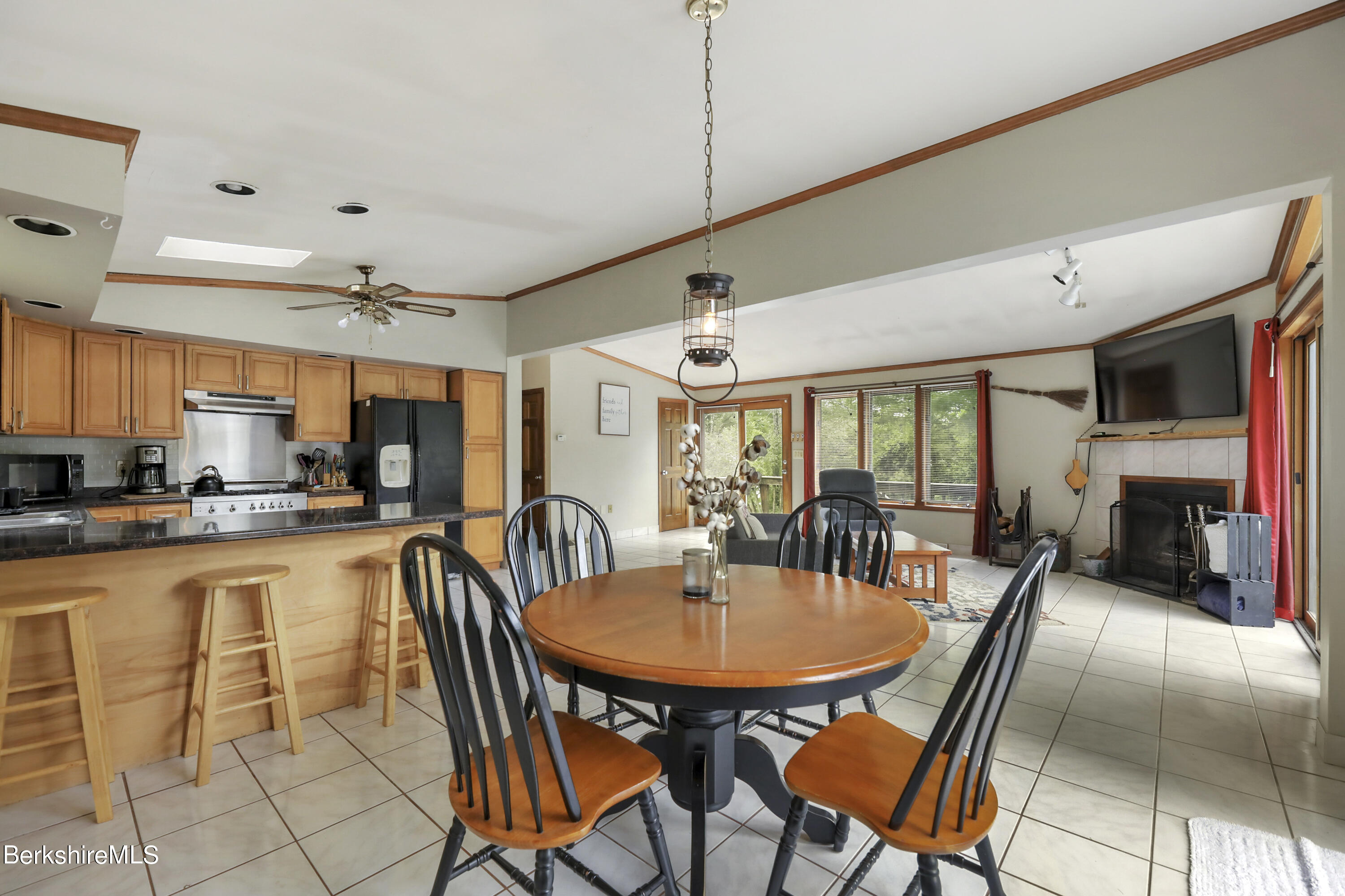 77 Shawnee Shore Road Becket, MA 01223 - Photo 6 of 28 a outdoor dining space with furniture and a kitchen view