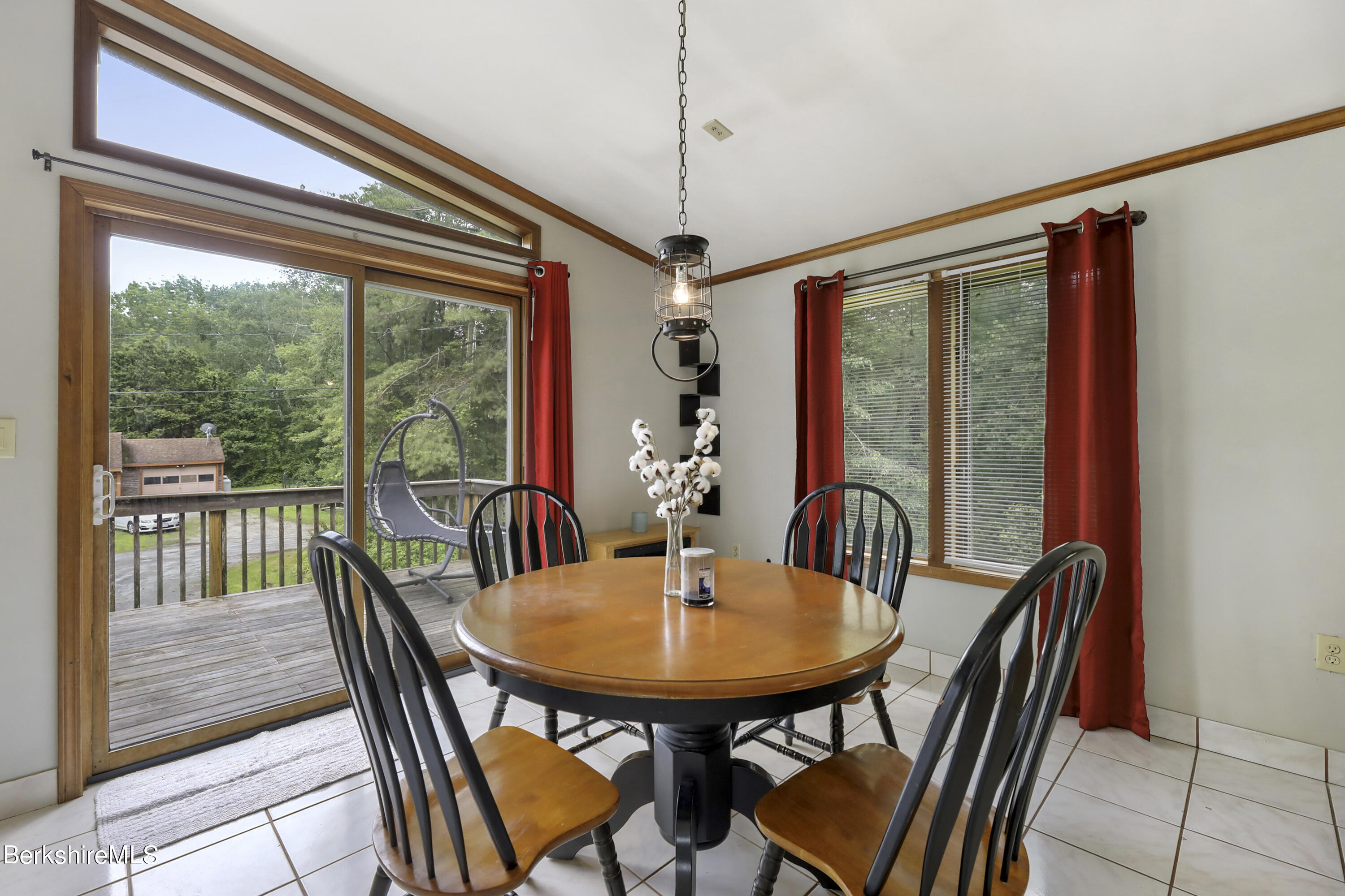 77 Shawnee Shore Road Becket, MA 01223 - Photo 7 of 28 a view of a dining room with furniture window and outside view