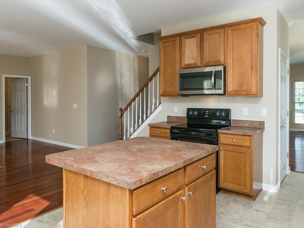 1309 Sharp Ridge Road Greensboro, NC 27406 - Photo 12 of 30 Kitchen facing Den and Door into Laundry room and garage entry