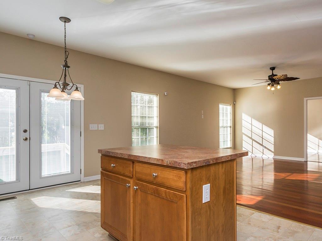 1309 Sharp Ridge Road Greensboro, NC 27406 - Photo 14 of 30 Kitchen to Den view, Door leading to office/study in far right of the photo