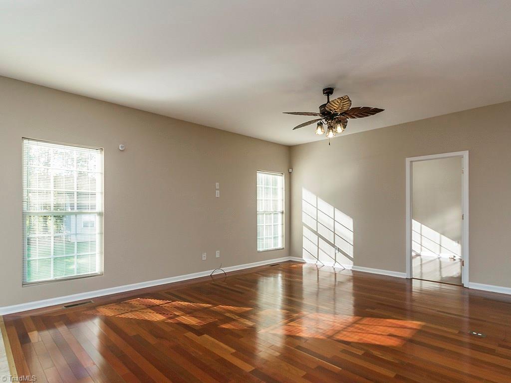 1309 Sharp Ridge Road Greensboro, NC 27406 - Photo 15 of 30 Den view from front hallway and stairs