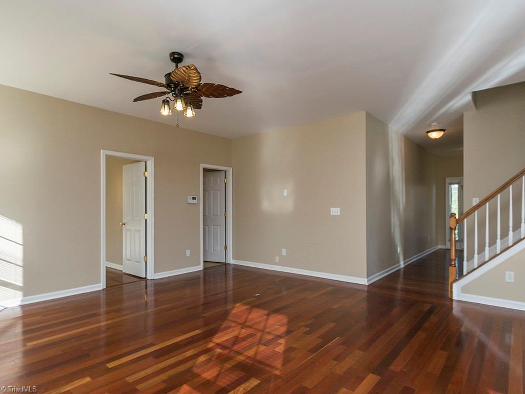 1309 Sharp Ridge Road Greensboro, NC 27406 - Photo 16 of 30 Den facing the front door. First door to the left leads into office, 2nd door to the left enters Laundry room