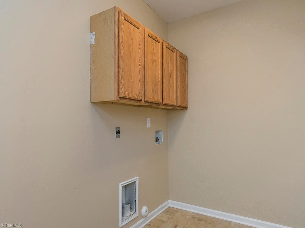 1309 Sharp Ridge Road Greensboro, NC 27406 - Photo 20 of 30 Laundry Room with cabinets. Door from Garage enters here