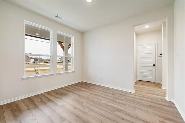 a view of a closet area with an empty room