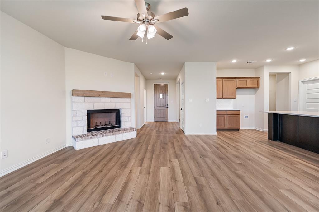 3107 White Oak Road Terrell, TX 75161 - Photo 21 of 40 a view of empty room with wooden floor and fireplace