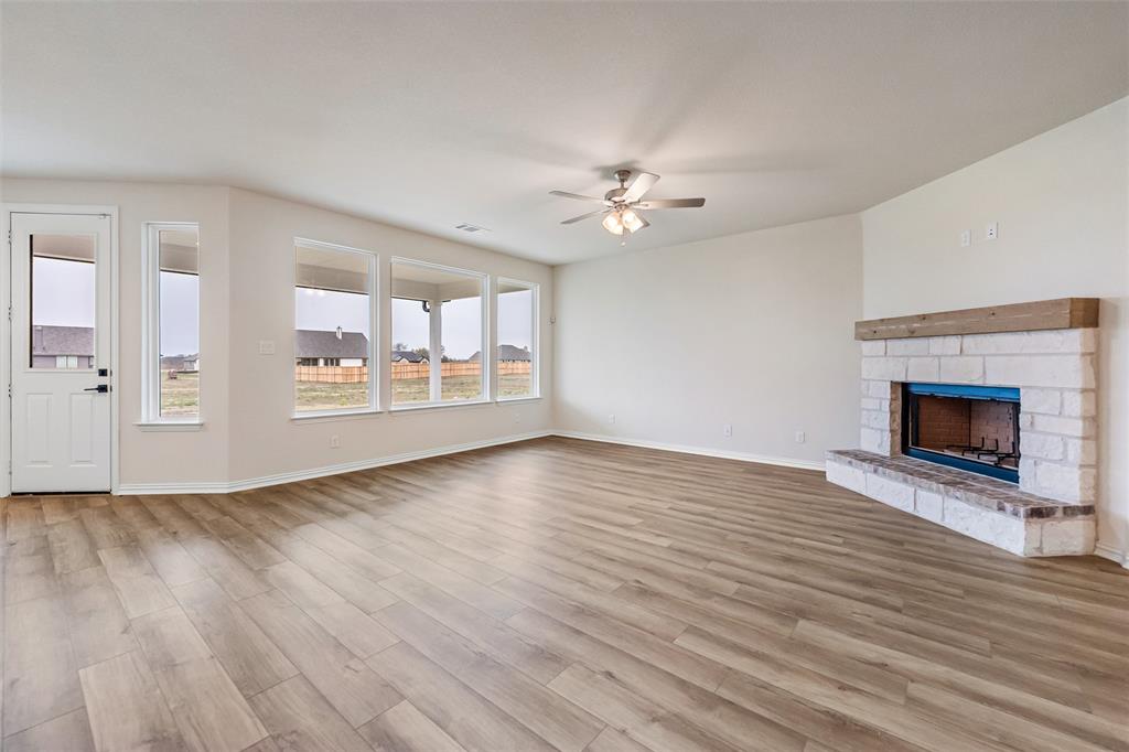 3107 White Oak Road Terrell, TX 75161 - Photo 23 of 40 wooden floor in an empty room with a fireplace