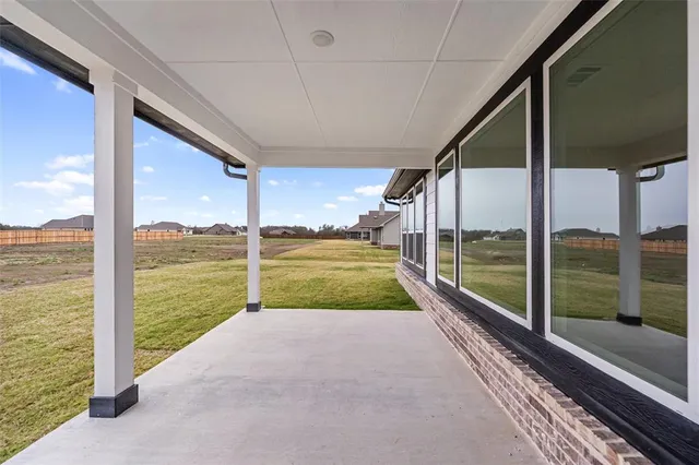 a view of a balcony with ocean view