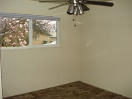 2772 Irwin Road Redding, CA 96002 - Photo 3 of 13 a view of a small space with wooden floor and a window