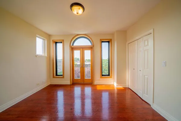 a view of entryway with wooden floor and window