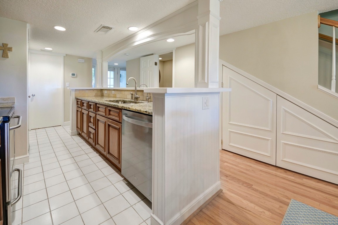 3052 Sea Marsh Road Fernandina Beach, FL 32034 - Photo 13 of 41 a kitchen with stainless steel appliances granite countertop a stove and a refrigerator
