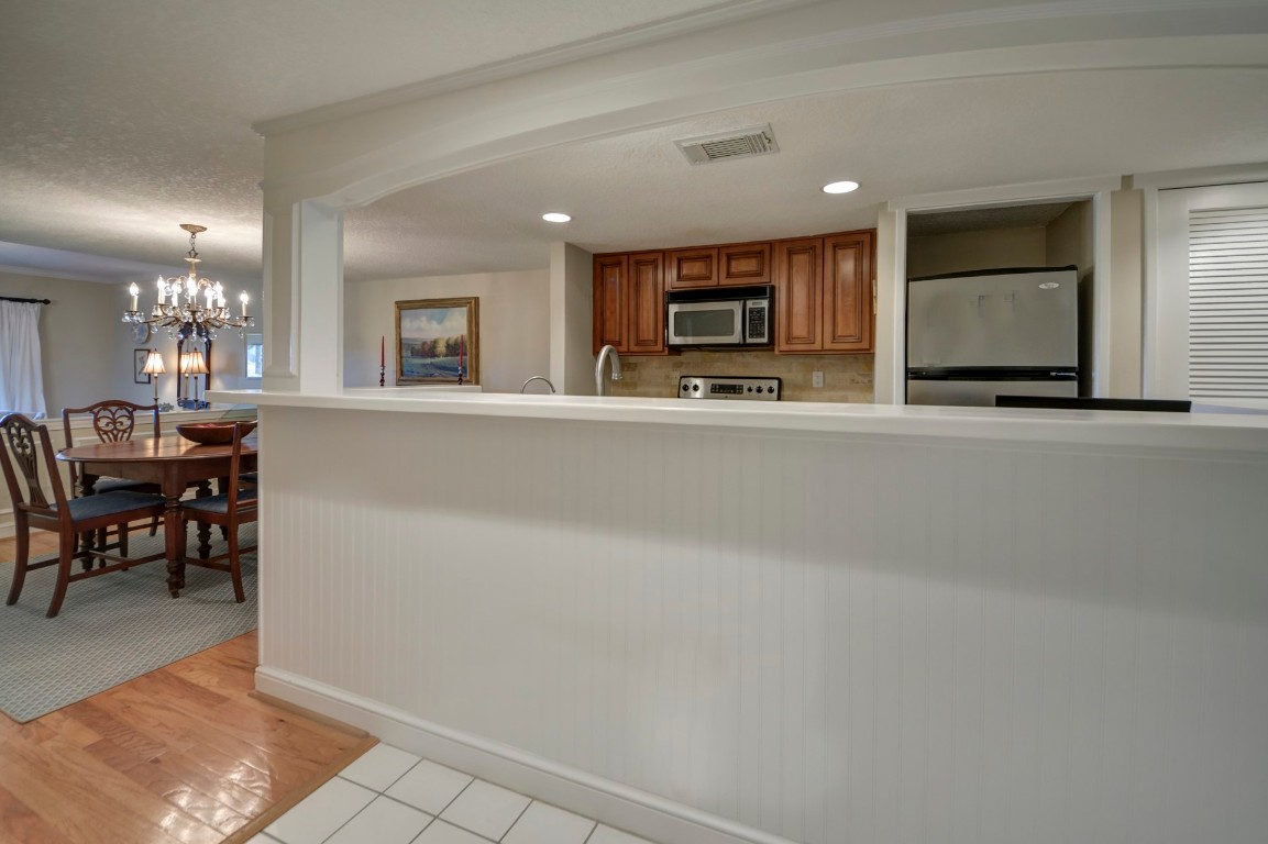 3052 Sea Marsh Road Fernandina Beach, FL 32034 - Photo 14 of 41 a living room with furniture a dining table and chairs