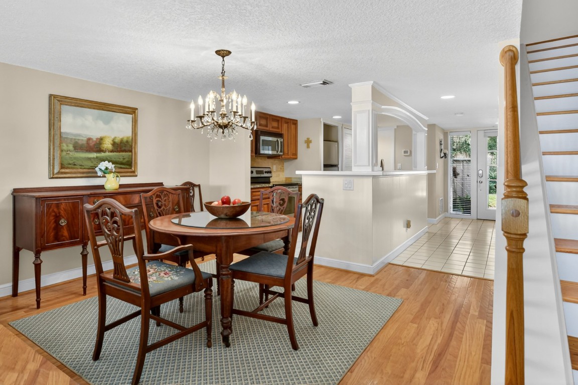 3052 Sea Marsh Road Fernandina Beach, FL 32034 - Photo 15 of 41 a view of a dining room with furniture and chandelier