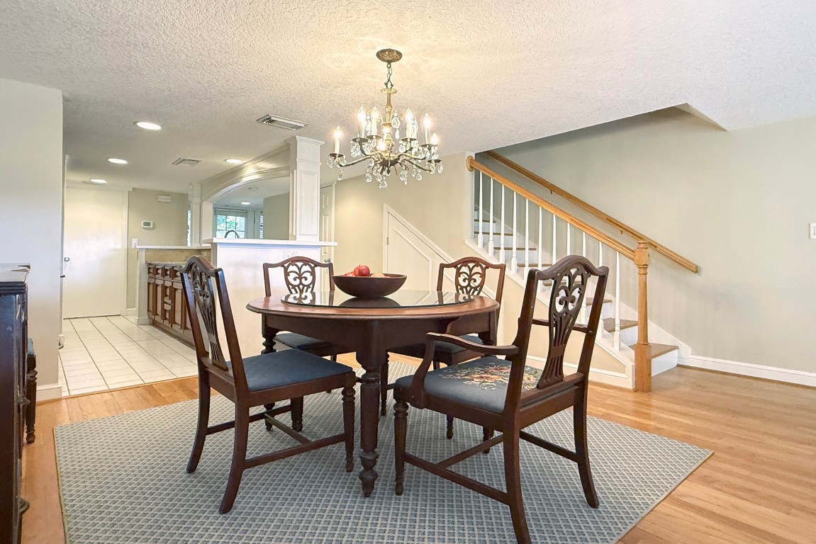 3052 Sea Marsh Road Fernandina Beach, FL 32034 - Photo 16 of 41 a view of a dining room with furniture and wooden floor