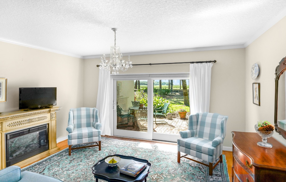 3052 Sea Marsh Road Fernandina Beach, FL 32034 - Photo 17 of 41 a living room with furniture and a fireplace