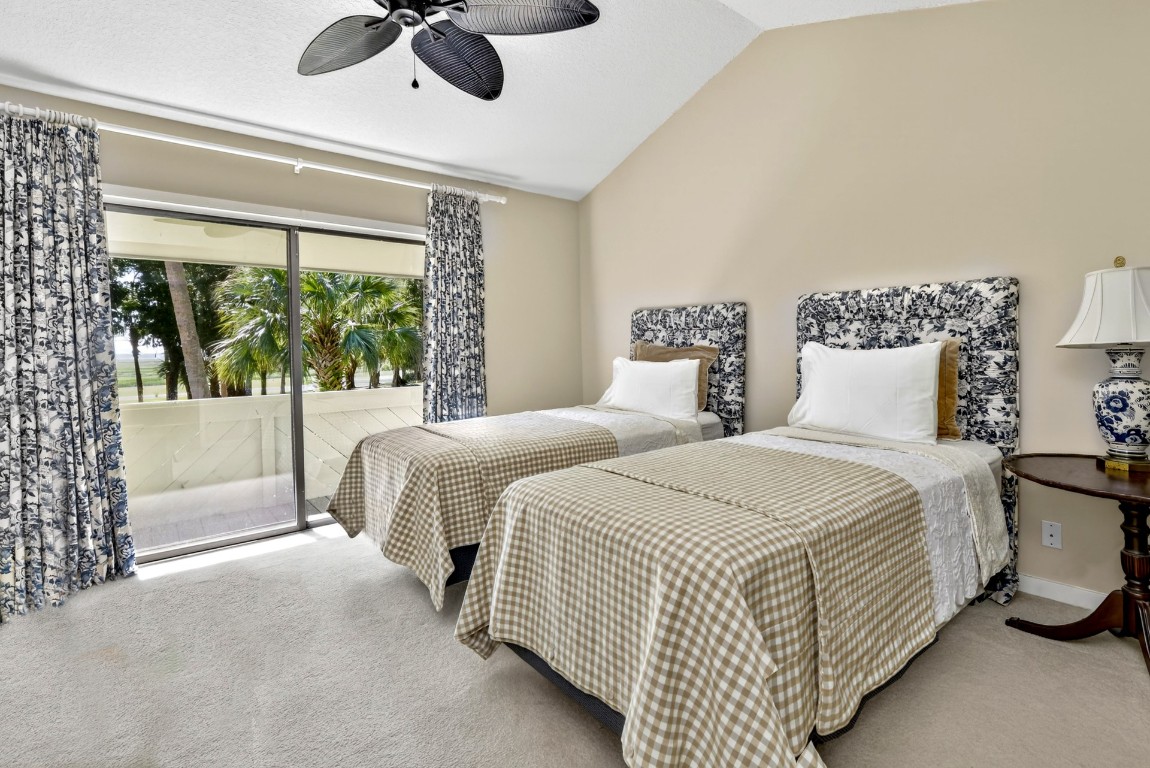 3052 Sea Marsh Road Fernandina Beach, FL 32034 - Photo 21 of 41 a bedroom with a bed and a large window