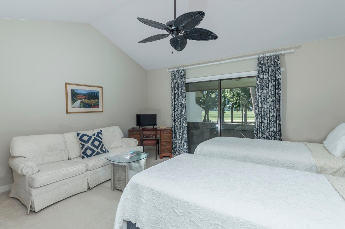 3052 Sea Marsh Road Fernandina Beach, FL 32034 - Photo 22 of 41 a spacious bedroom with a bed and a couch