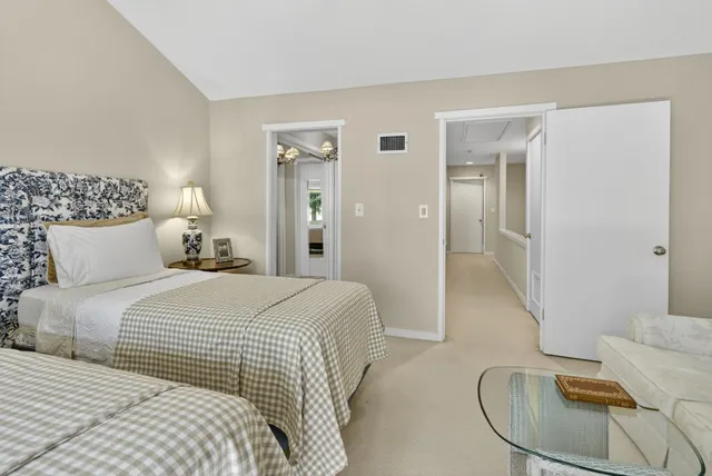 a spacious bathroom with a double vanity sink and a mirror