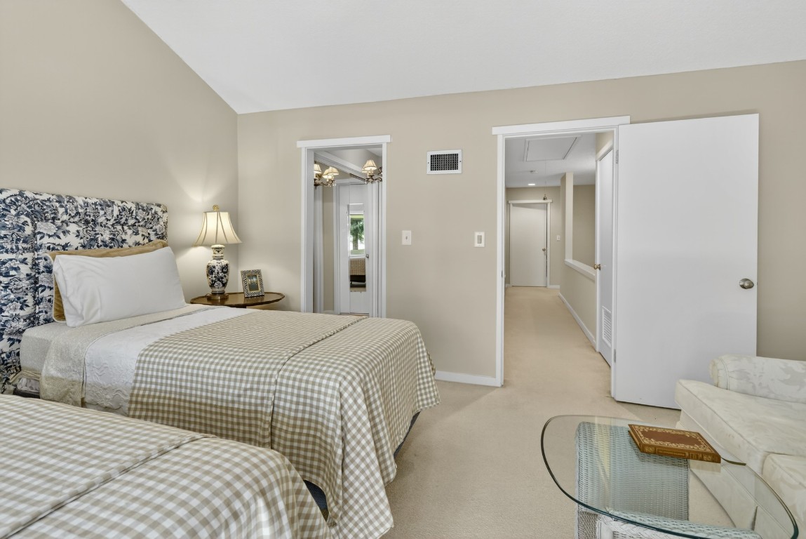 3052 Sea Marsh Road Fernandina Beach, FL 32034 - Photo 23 of 41 a bedroom with a bed and couch