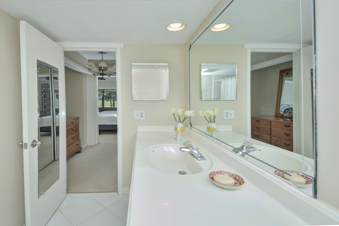 3052 Sea Marsh Road Fernandina Beach, FL 32034 - Photo 25 of 41 a bathroom with a sink and a mirror