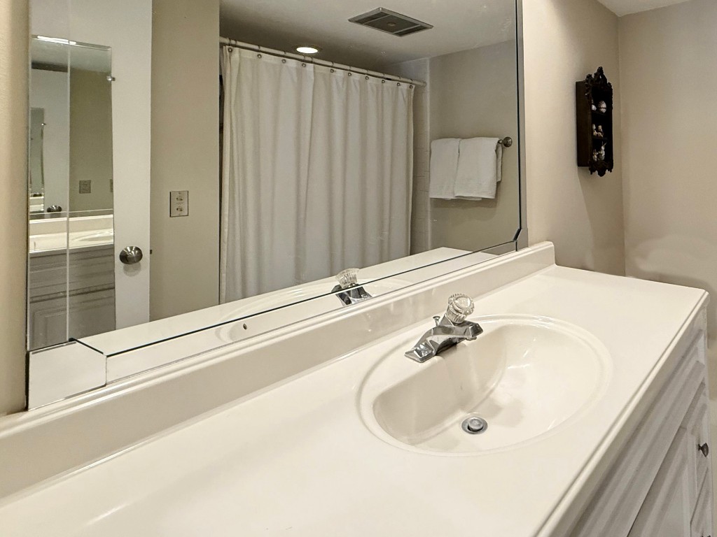 3052 Sea Marsh Road Fernandina Beach, FL 32034 - Photo 27 of 41 a bathroom with a sink and a mirror