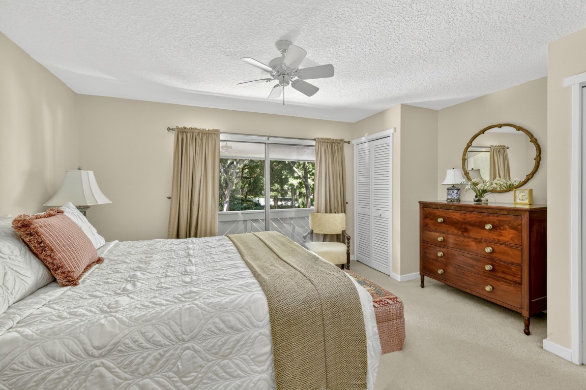 3052 Sea Marsh Road Fernandina Beach, FL 32034 - Photo 28 of 41 a bedroom with a bed and a dresser