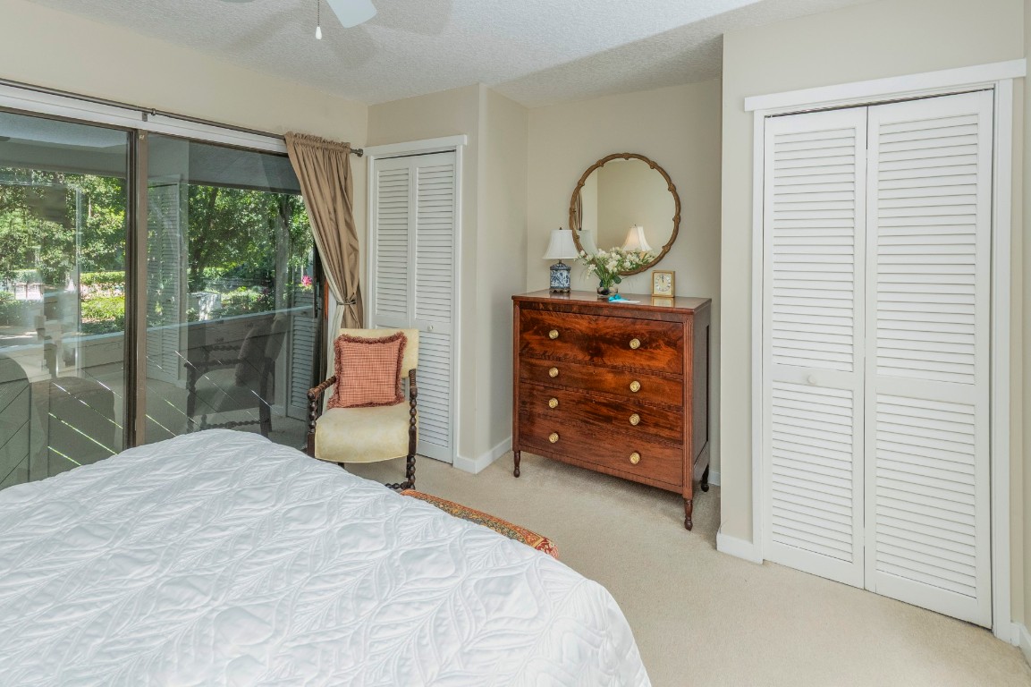 3052 Sea Marsh Road Fernandina Beach, FL 32034 - Photo 30 of 41 a bedroom with a bed and a dresser