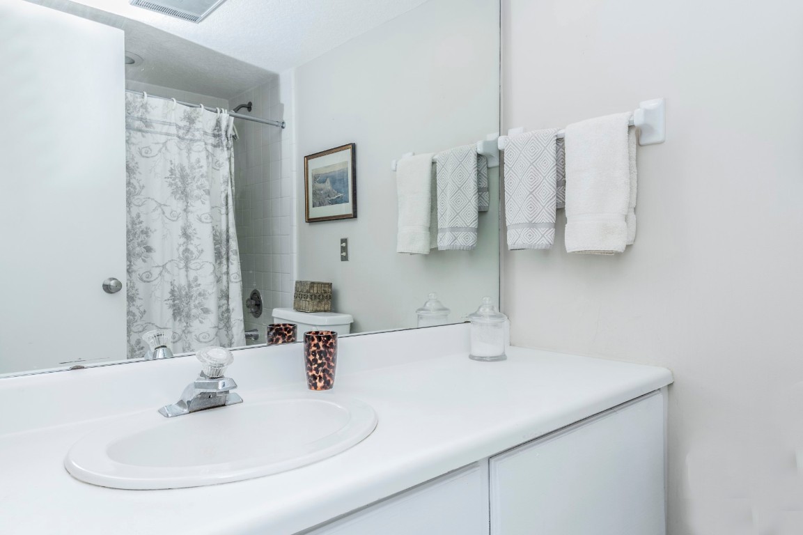3052 Sea Marsh Road Fernandina Beach, FL 32034 - Photo 31 of 41 a bathroom with a sink and a mirror