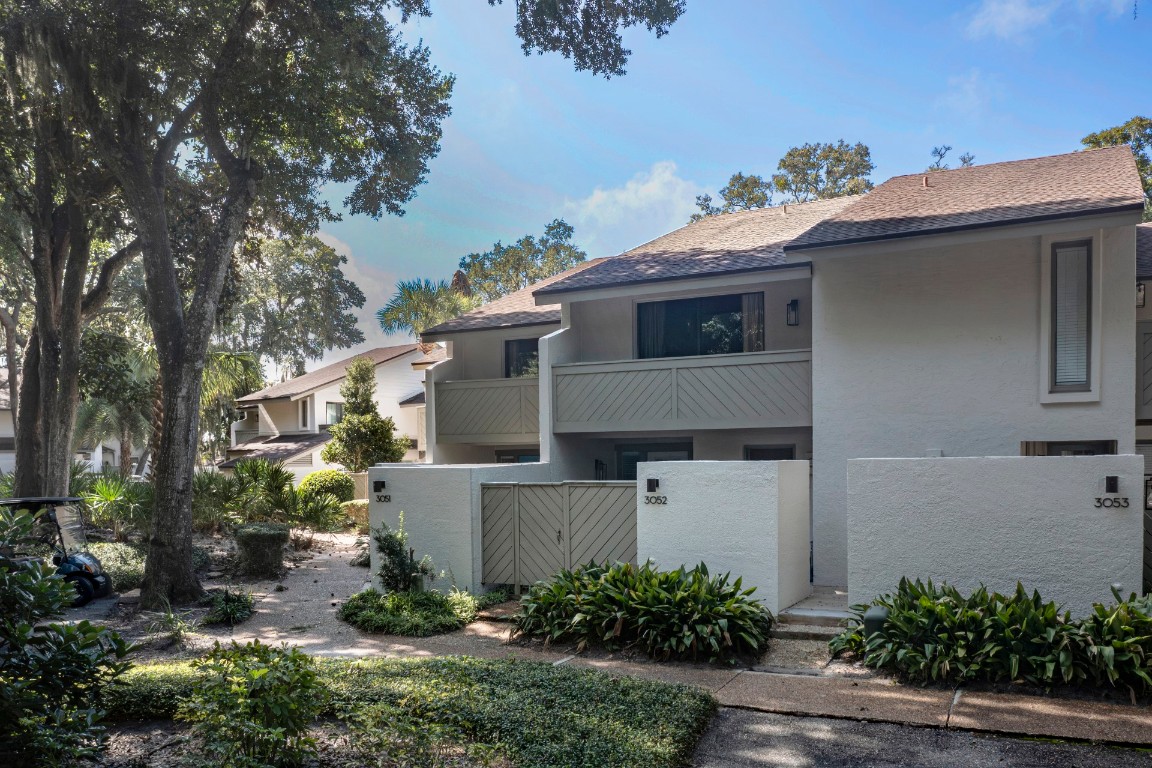 3052 Sea Marsh Road Fernandina Beach, FL 32034 - Photo 35 of 41 a front view of a house with a yard