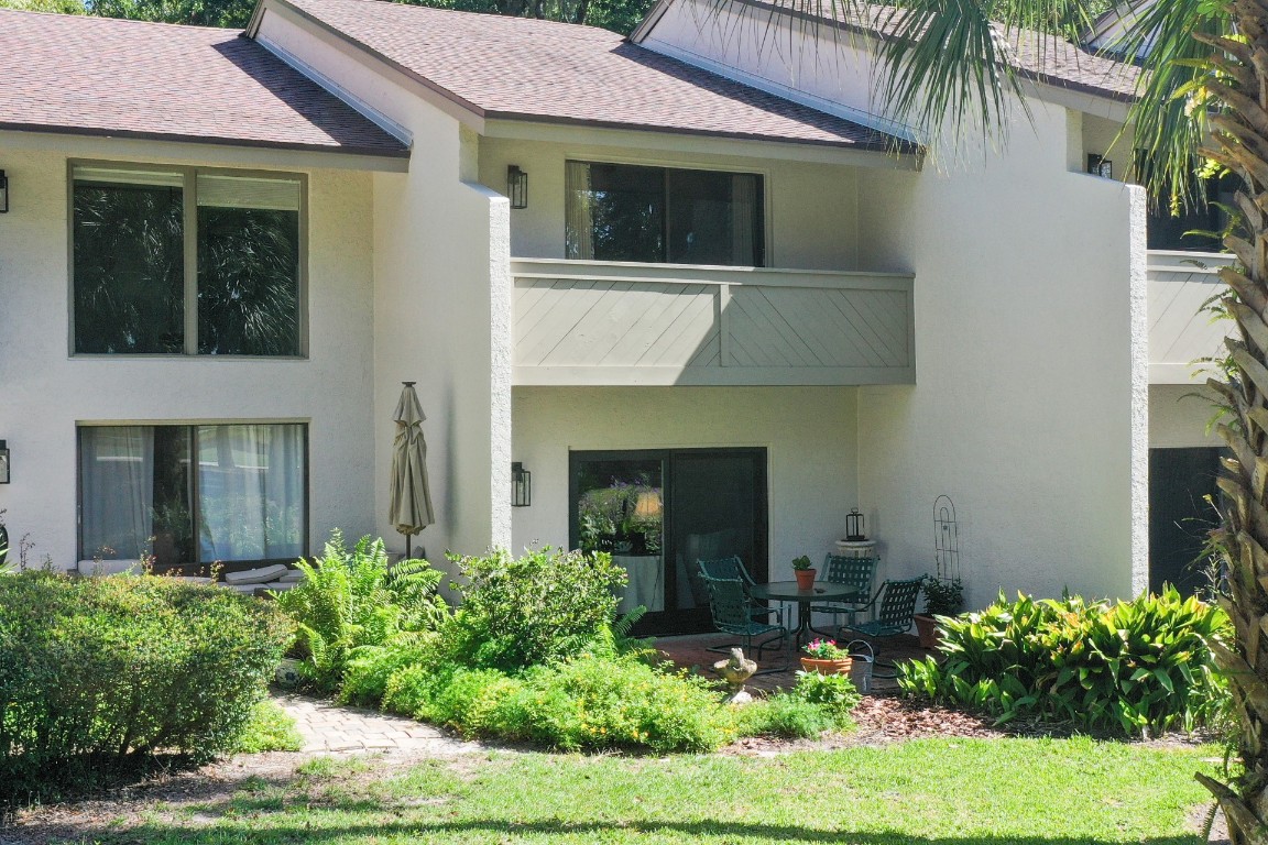 3052 Sea Marsh Road Fernandina Beach, FL 32034 - Photo 36 of 41 a front view of a house with garden