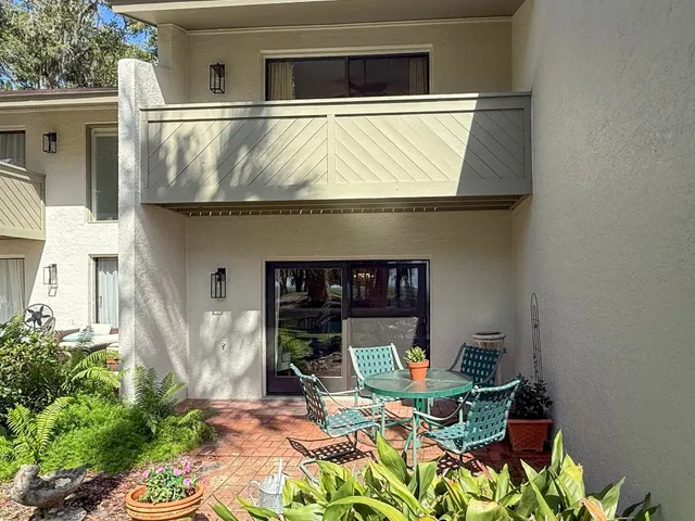 a outdoor space with a table and chairs