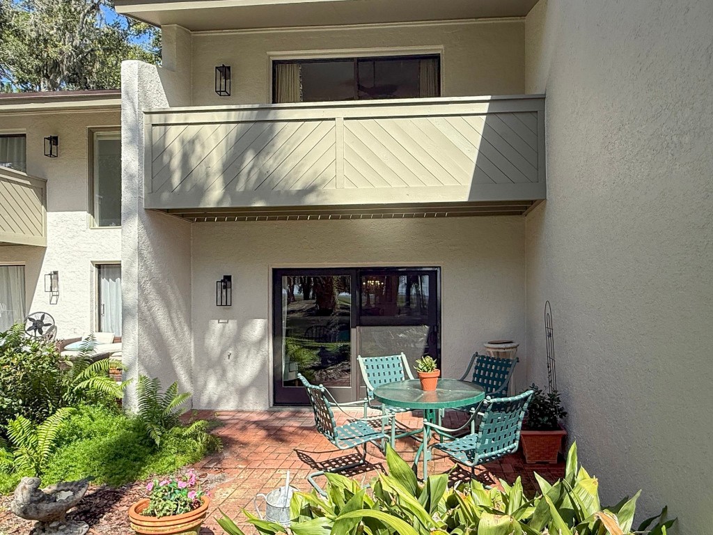 3052 Sea Marsh Road Fernandina Beach, FL 32034 - Photo 38 of 41 a front view of a house with patio
