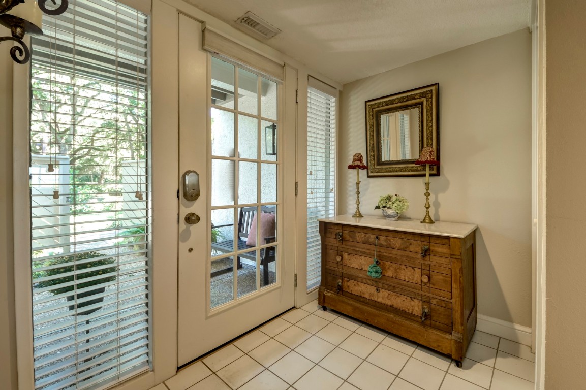3052 Sea Marsh Road Fernandina Beach, FL 32034 - Photo 6 of 41 a bathroom with a sink a mirror and a shower