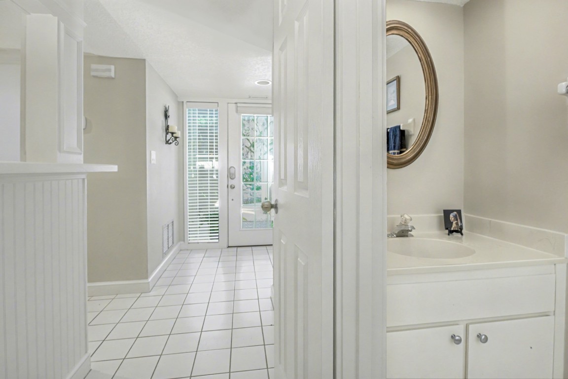 3052 Sea Marsh Road Fernandina Beach, FL 32034 - Photo 7 of 41 a bathroom with a sink and a mirror