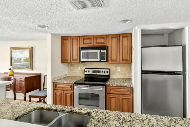 a view of a kitchen from the hallway
